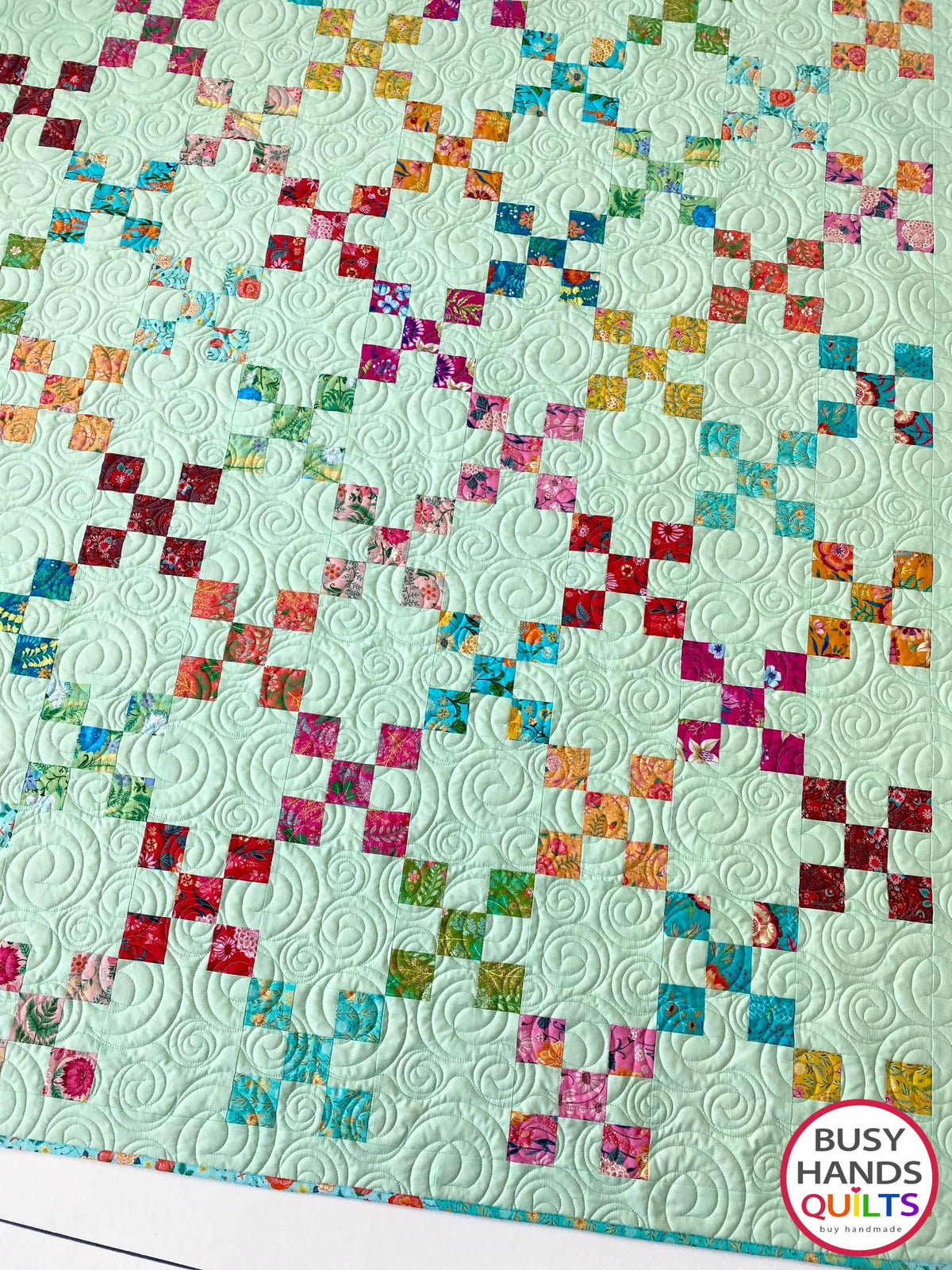 Handmade, heirloom-quality traditional 9-patch quilt in pretty floral prints on a solid mint colored background. Perfect as a Christmas present idea or birthday gift idea for women and young girls.