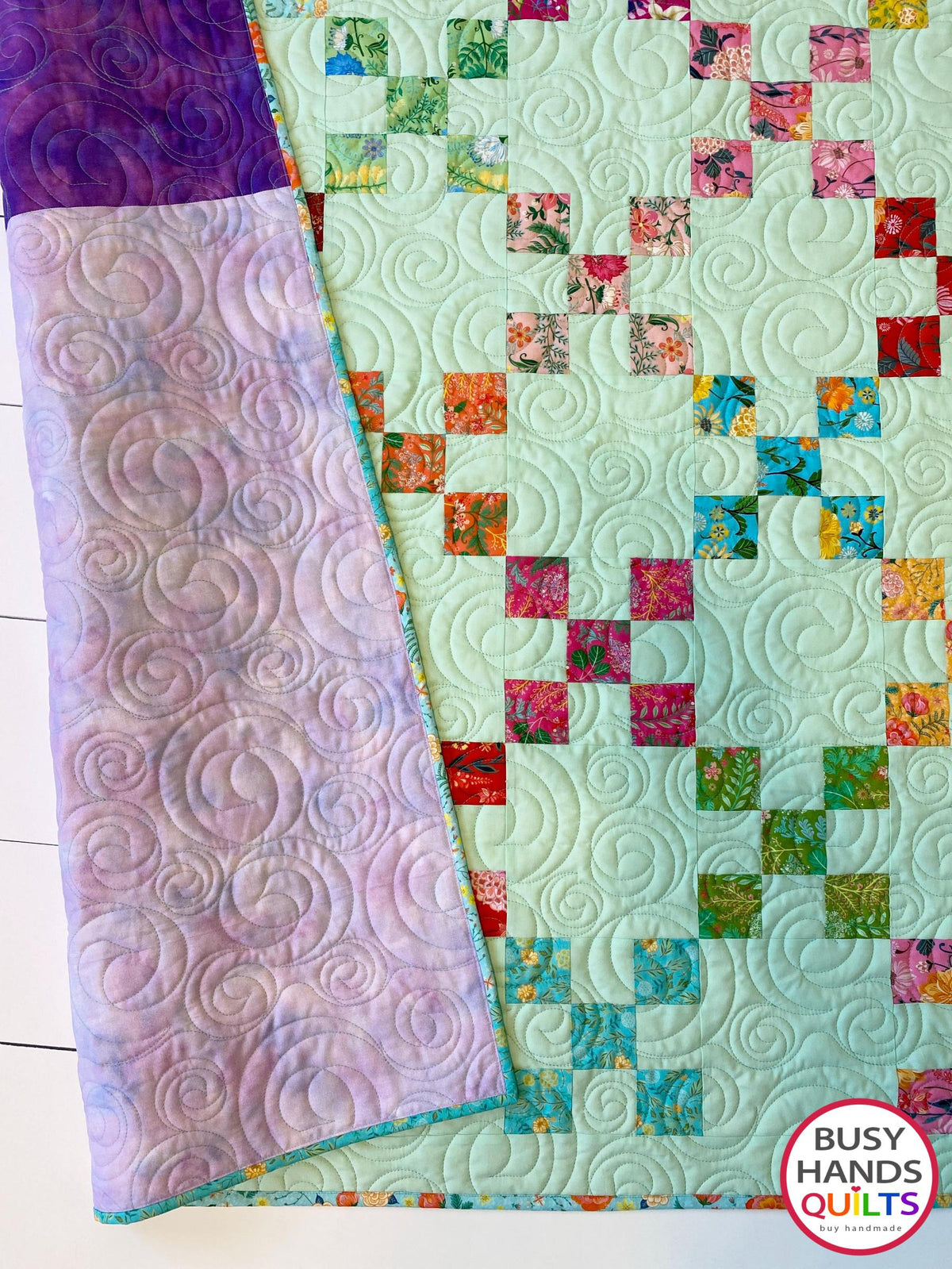 Handmade, heirloom-quality traditional 9-patch quilt in pretty floral prints on a solid mint colored background. Perfect as a Christmas present idea or birthday gift idea for women and young girls.