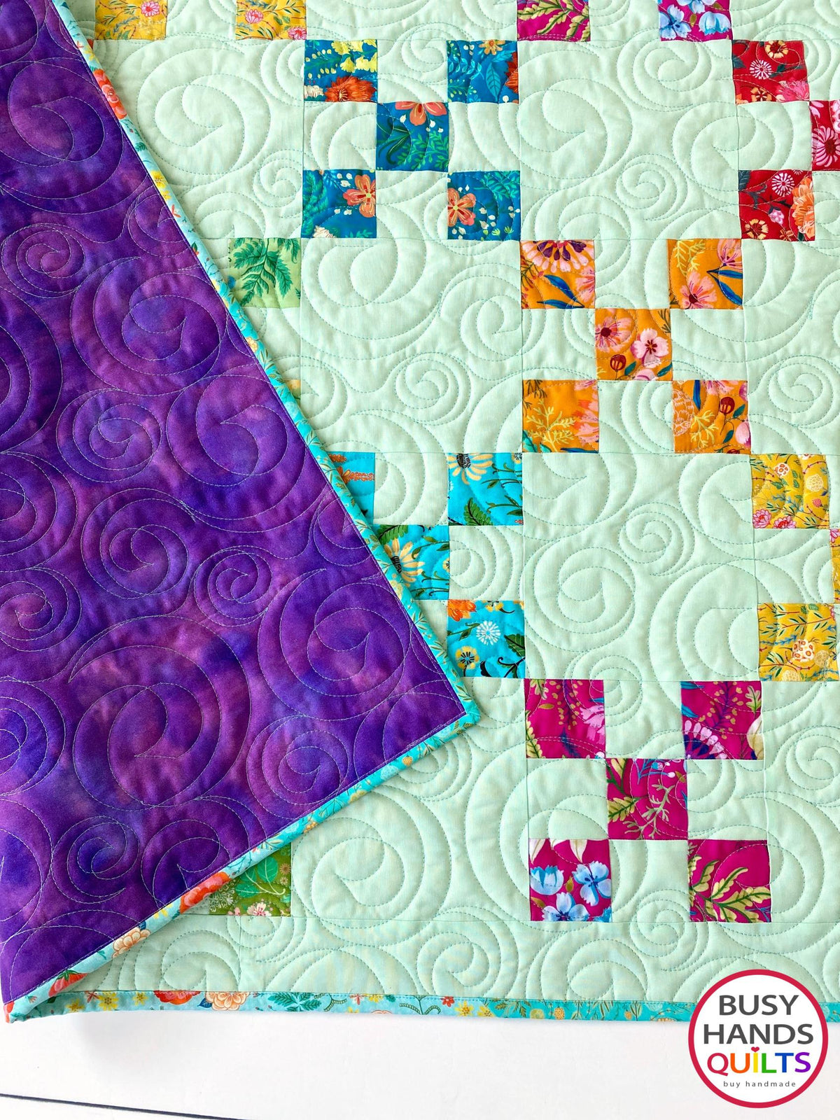 Handmade, heirloom-quality traditional 9-patch quilt in pretty floral prints on a solid mint colored background. Perfect as a Christmas present idea or birthday gift idea for women and young girls.
