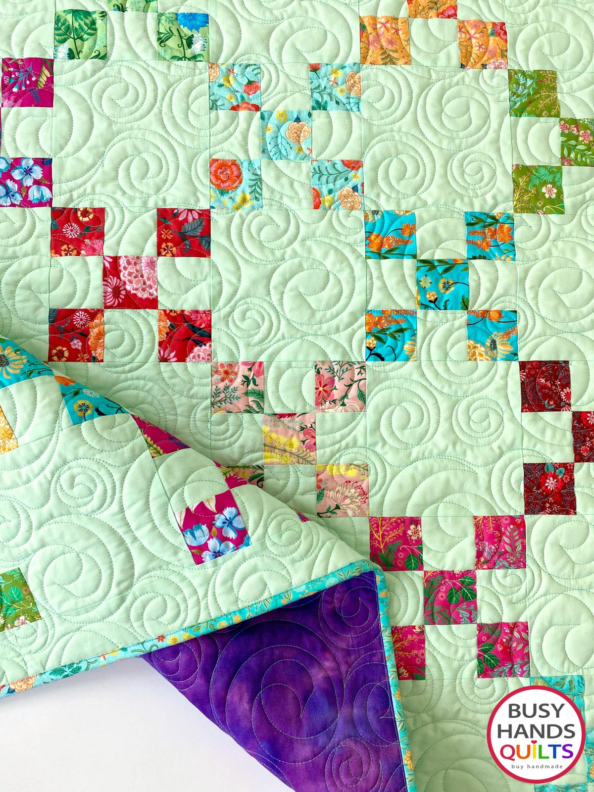 Handmade, heirloom-quality traditional 9-patch quilt in pretty floral prints on a solid mint colored background. Perfect as a Christmas present idea or birthday gift idea for women and young girls.