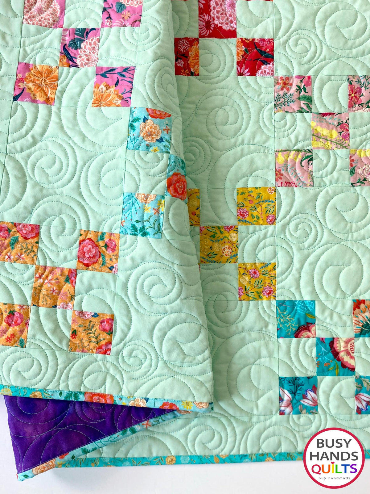 Handmade, heirloom-quality traditional 9-patch quilt in pretty floral prints on a solid mint colored background. Perfect as a Christmas present idea or birthday gift idea for women and young girls.
