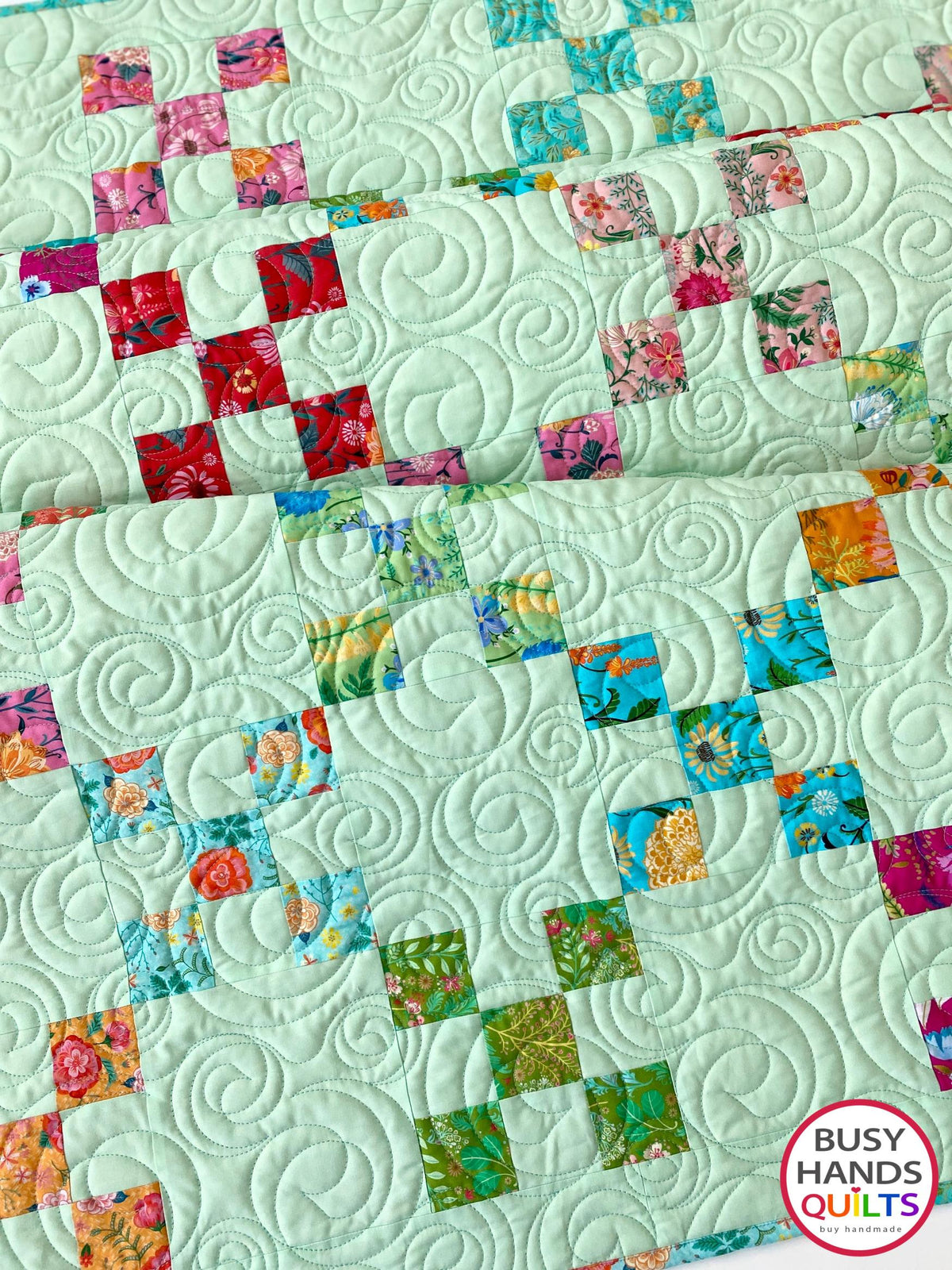 Handmade, heirloom-quality traditional 9-patch quilt in pretty floral prints on a solid mint colored background. Perfect as a Christmas present idea or birthday gift idea for women and young girls.