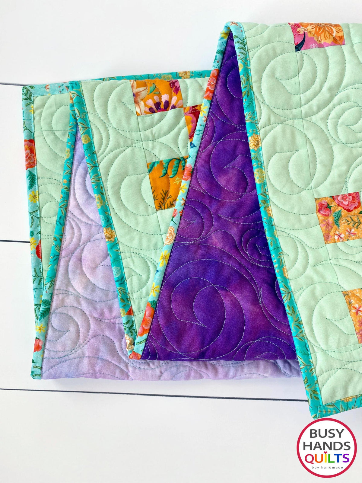 Handmade, heirloom-quality traditional 9-patch quilt in pretty floral prints on a solid mint colored background. Perfect as a Christmas present idea or birthday gift idea for women and young girls.