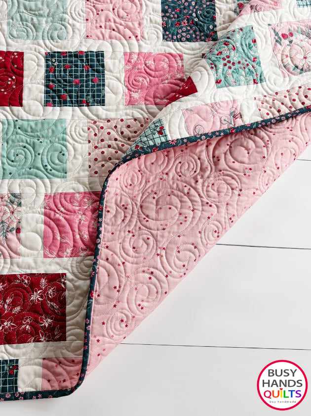 Handmade, heirloom-quality patchwork throw quilt in red, pink, teal, and creamy white. Perfect Christmas present for women and young ladies, or a birthday gift idea.