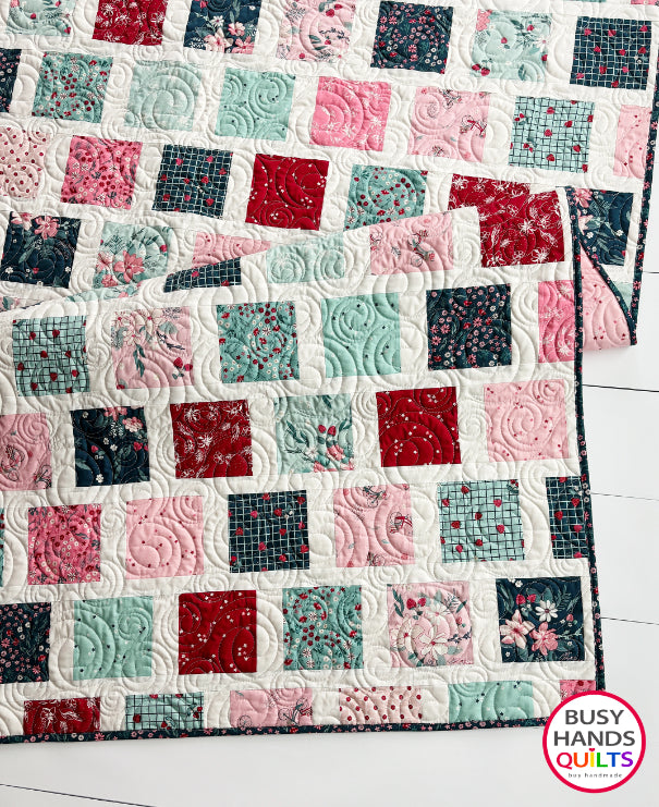 Handmade, heirloom-quality patchwork throw quilt in red, pink, teal, and creamy white. Perfect Christmas present for women and young ladies, or a birthday gift idea.