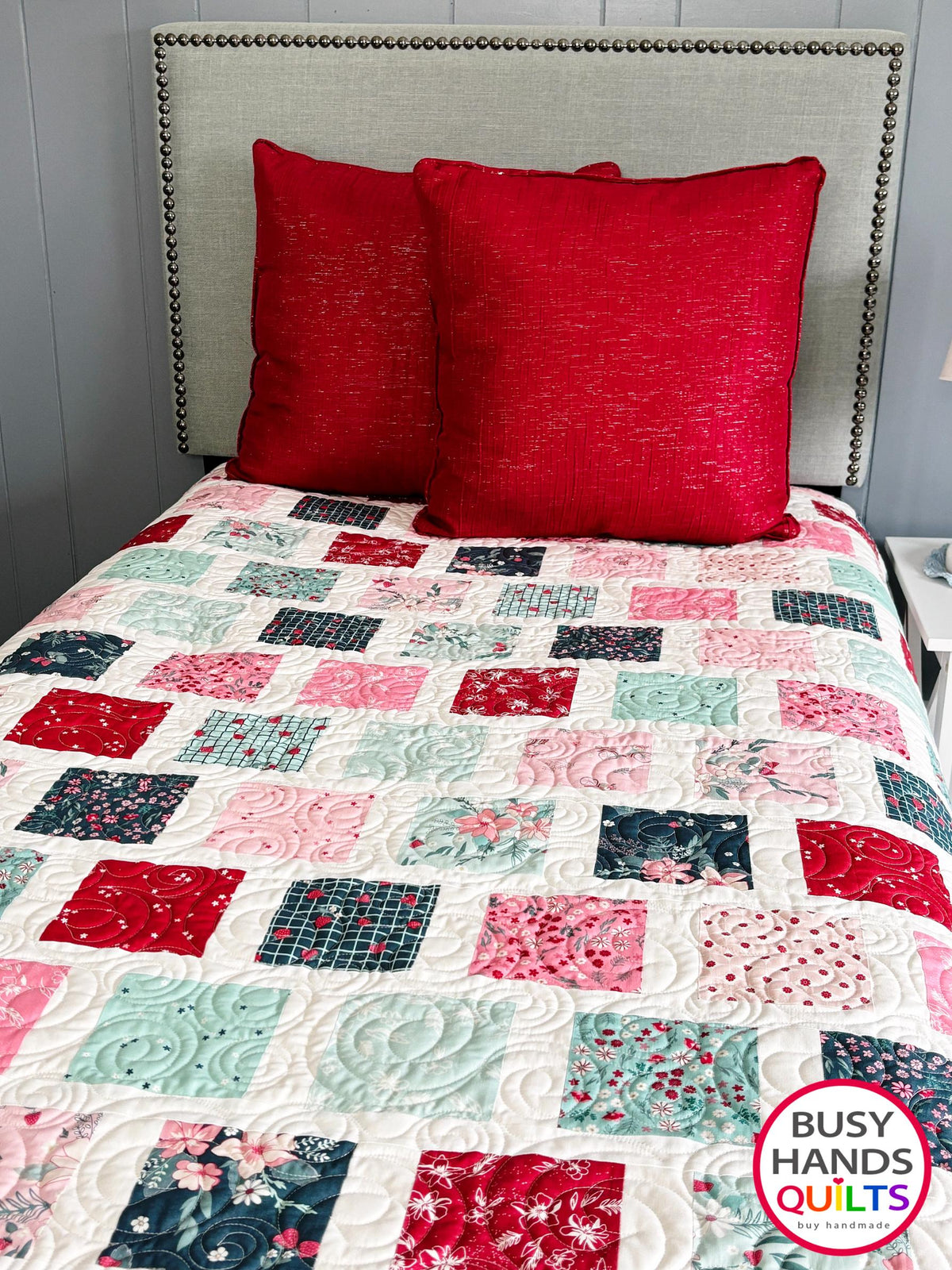 Handmade, heirloom-quality patchwork throw quilt in red, pink, teal, and creamy white. Perfect Christmas present for women and young ladies, or a birthday gift idea.