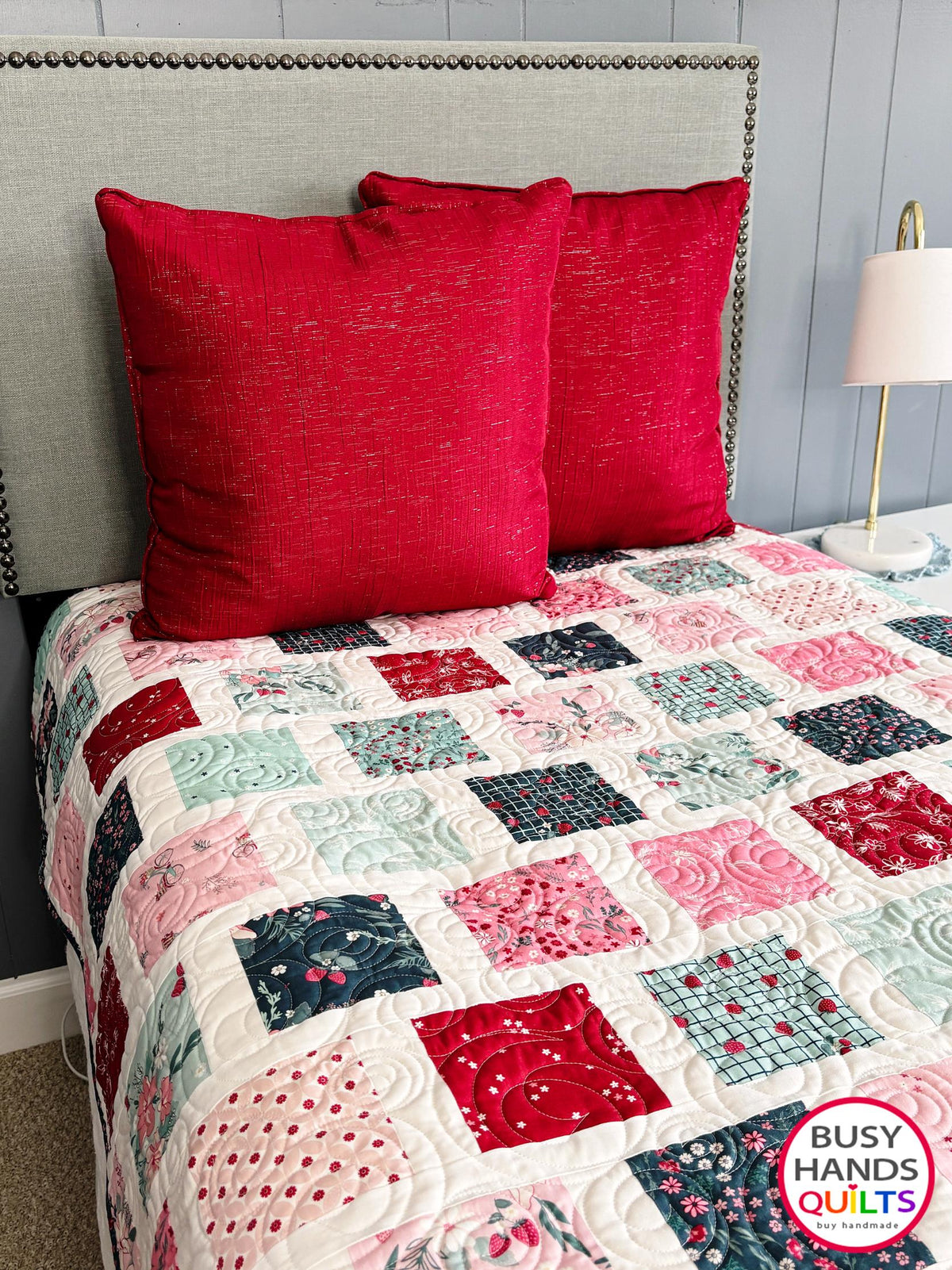 Handmade, heirloom-quality patchwork throw quilt in red, pink, teal, and creamy white. Perfect Christmas present for women and young ladies, or a birthday gift idea.