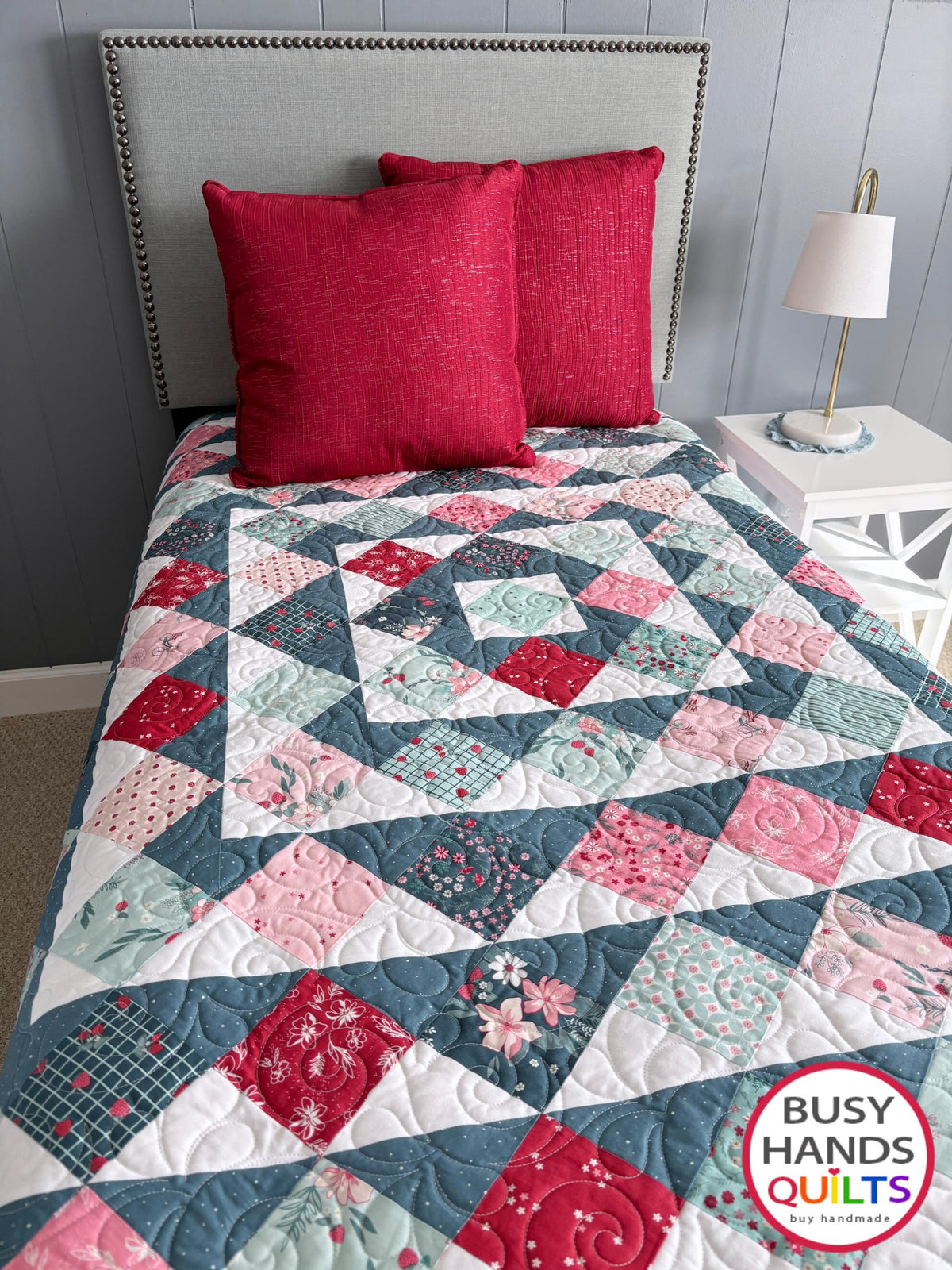 Handmade, heirloom-quality throw quilt in Skip to My Lou quilt design in pink, red, and teal florals. Perfect Christmas present idea, or birthday gift idea for women or young girl.