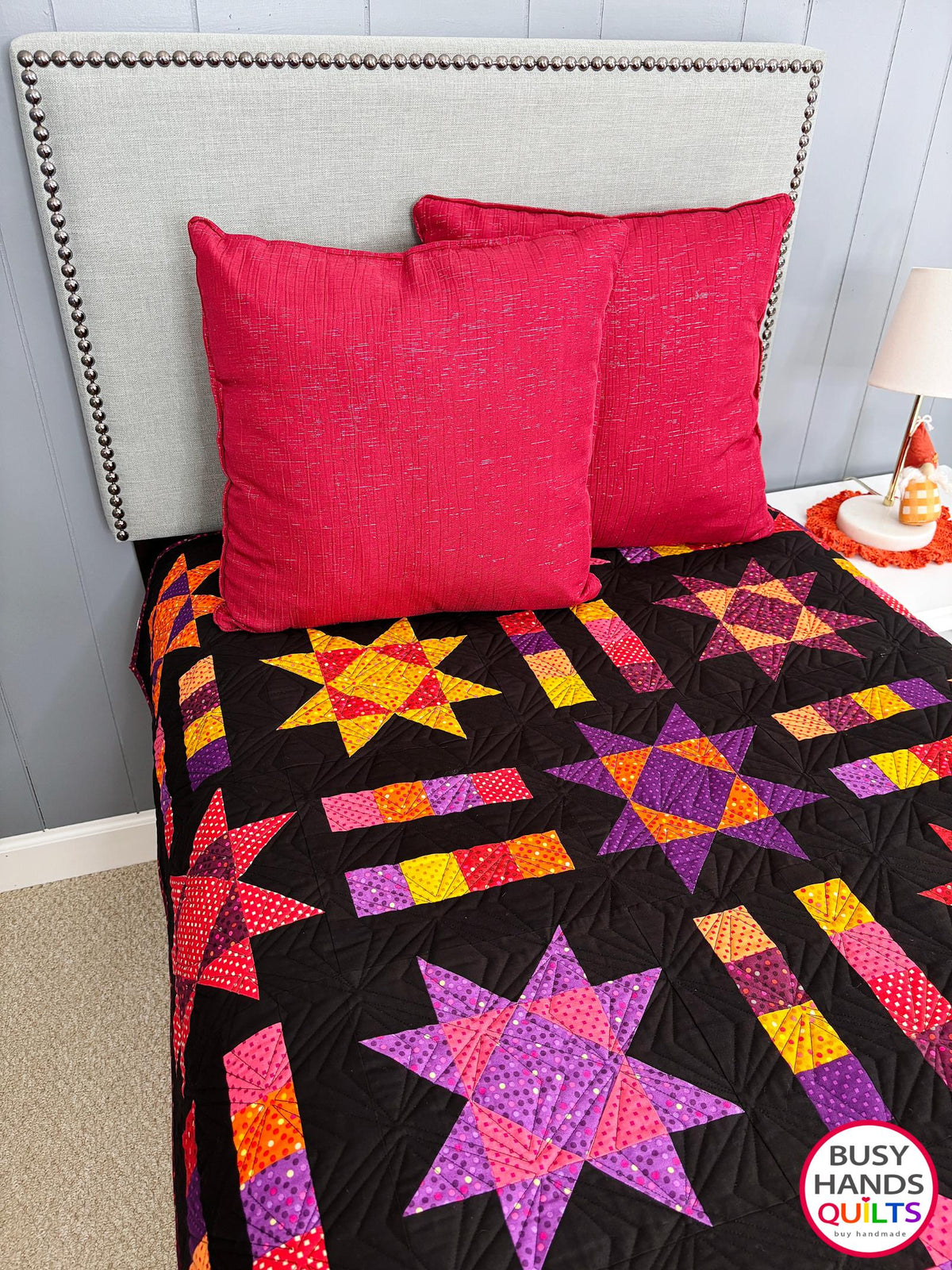 Handmade, heirloom-quality throw star and stripe quilt in vivid purple, pink, red, orange, and yellow. Perfect Christmas present idea, birthday gift ideas for teens, and wedding gifts for brides.