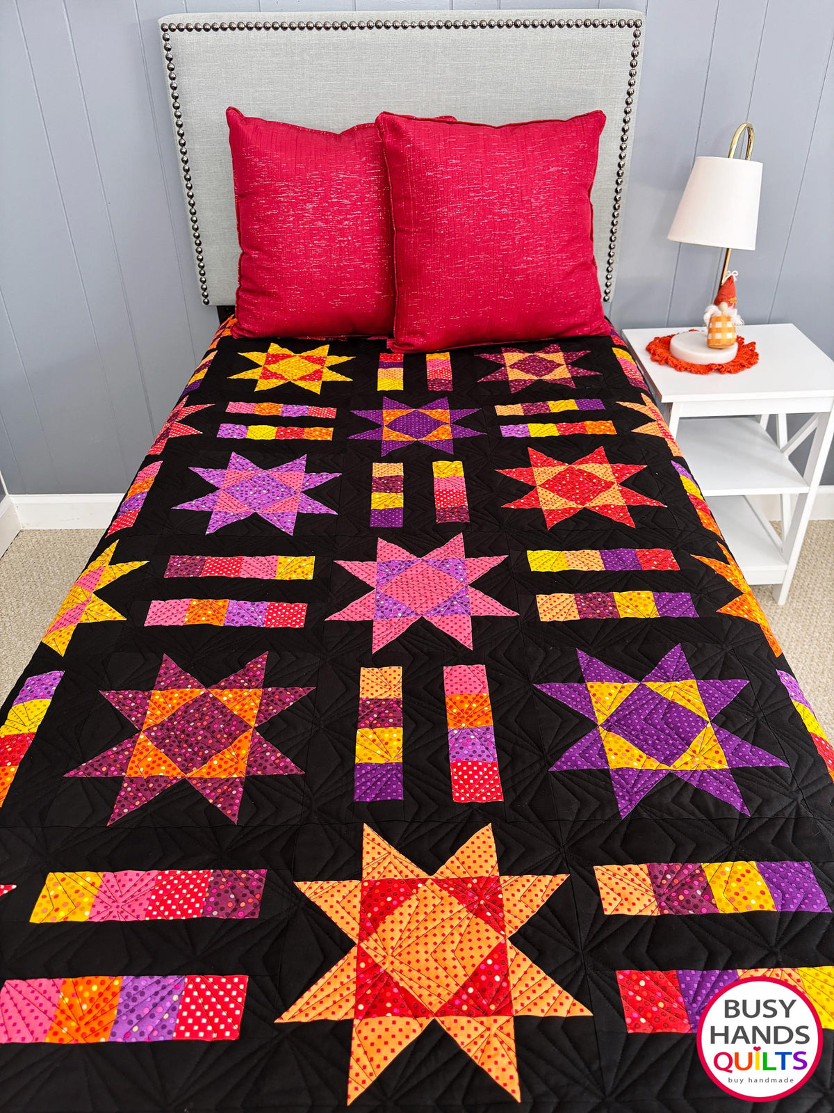 Handmade, heirloom-quality throw star and stripe quilt in vivid purple, pink, red, orange, and yellow. Perfect Christmas present idea, birthday gift ideas for teens, and wedding gifts for brides.