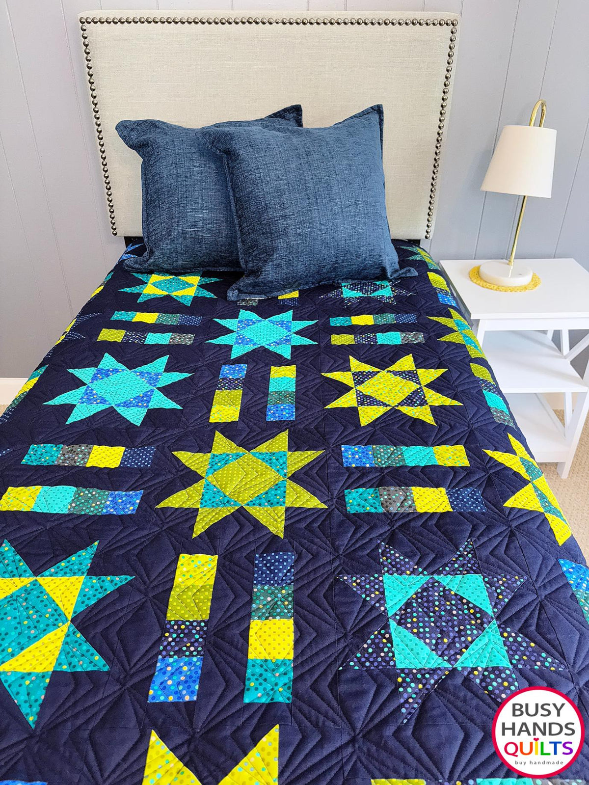 Handmade, heirloom-quality Throw Quilt with Stars and Stripes of Squares in blue, lime green, and aqua on a navy background. Perfect Christmas present idea, birthday gift idea with bright colors.