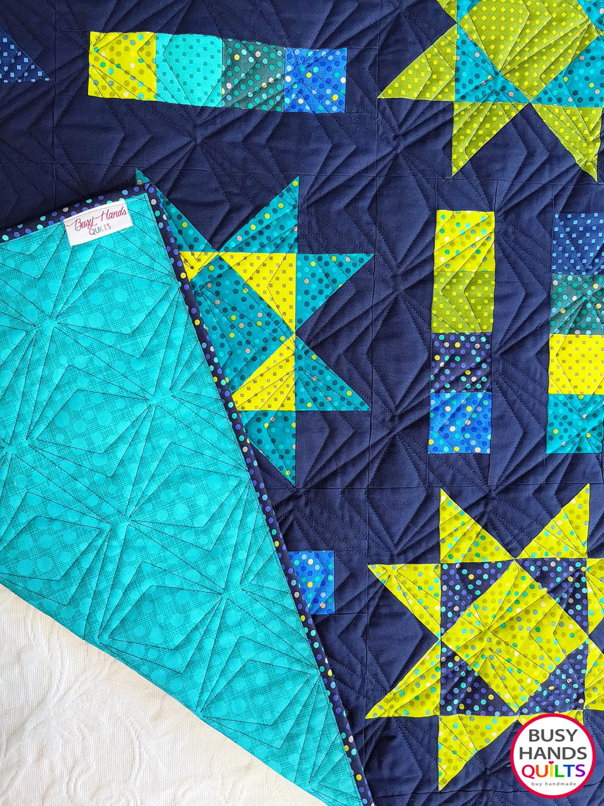Handmade, heirloom-quality Throw Quilt with Stars and Stripes of Squares in blue, lime green, and aqua on a navy background. Perfect Christmas present idea, birthday gift idea with bright colors.