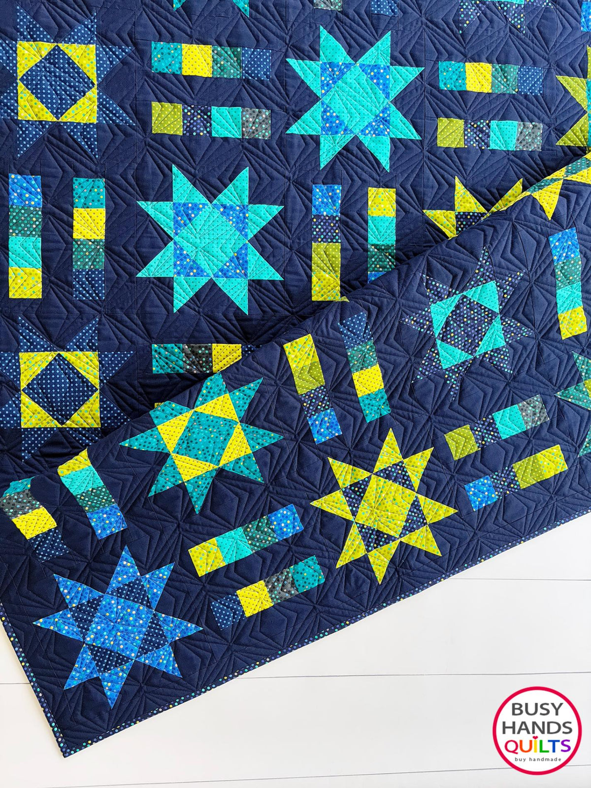 Handmade, heirloom-quality Throw Quilt with Stars and Stripes of Squares in blue, lime green, and aqua on a navy background. Perfect Christmas present idea, birthday gift idea with bright colors.