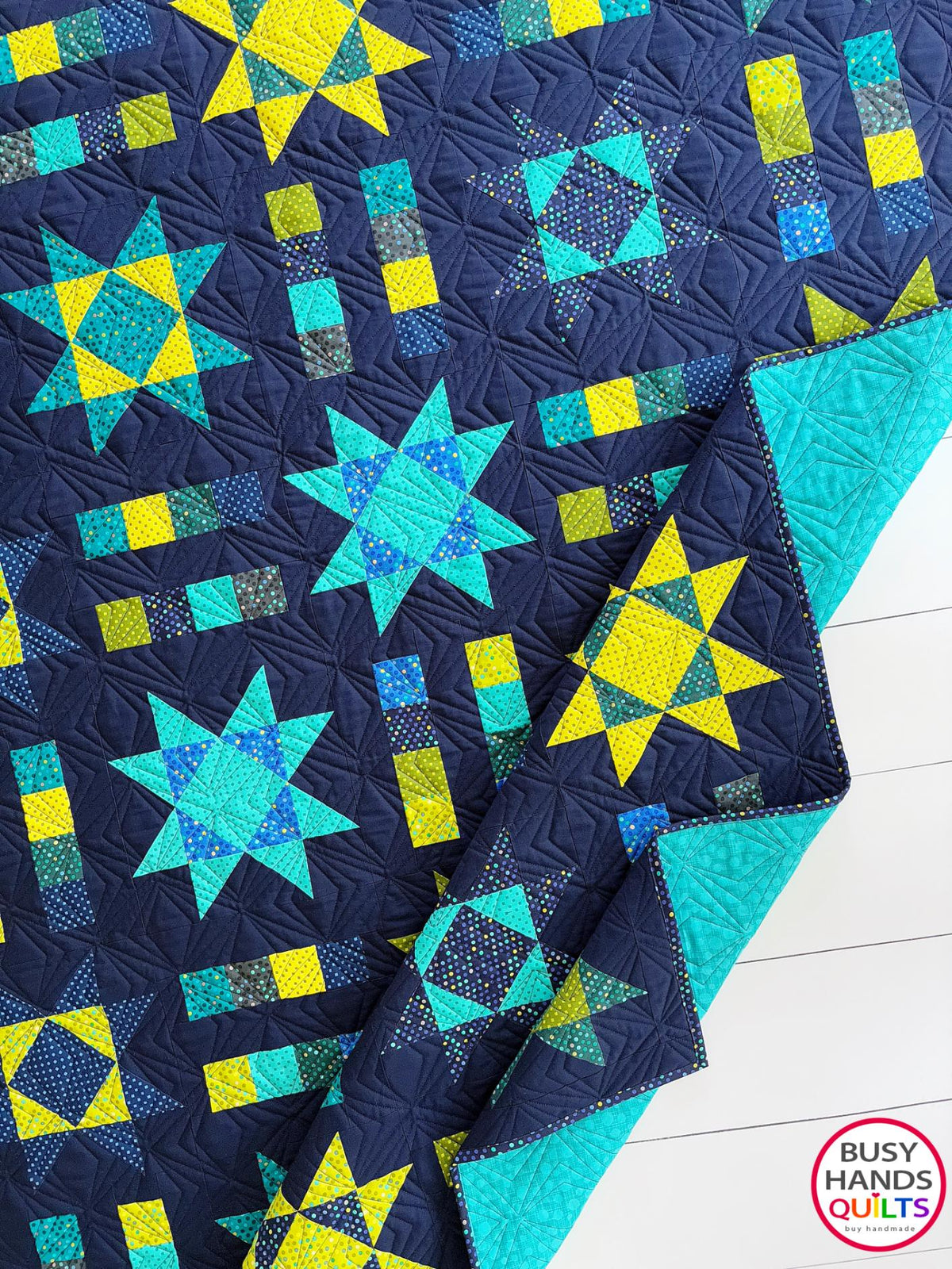Handmade, heirloom-quality Throw Quilt with Stars and Stripes of Squares in blue, lime green, and aqua on a navy background. Perfect Christmas present idea, birthday gift idea with bright colors.