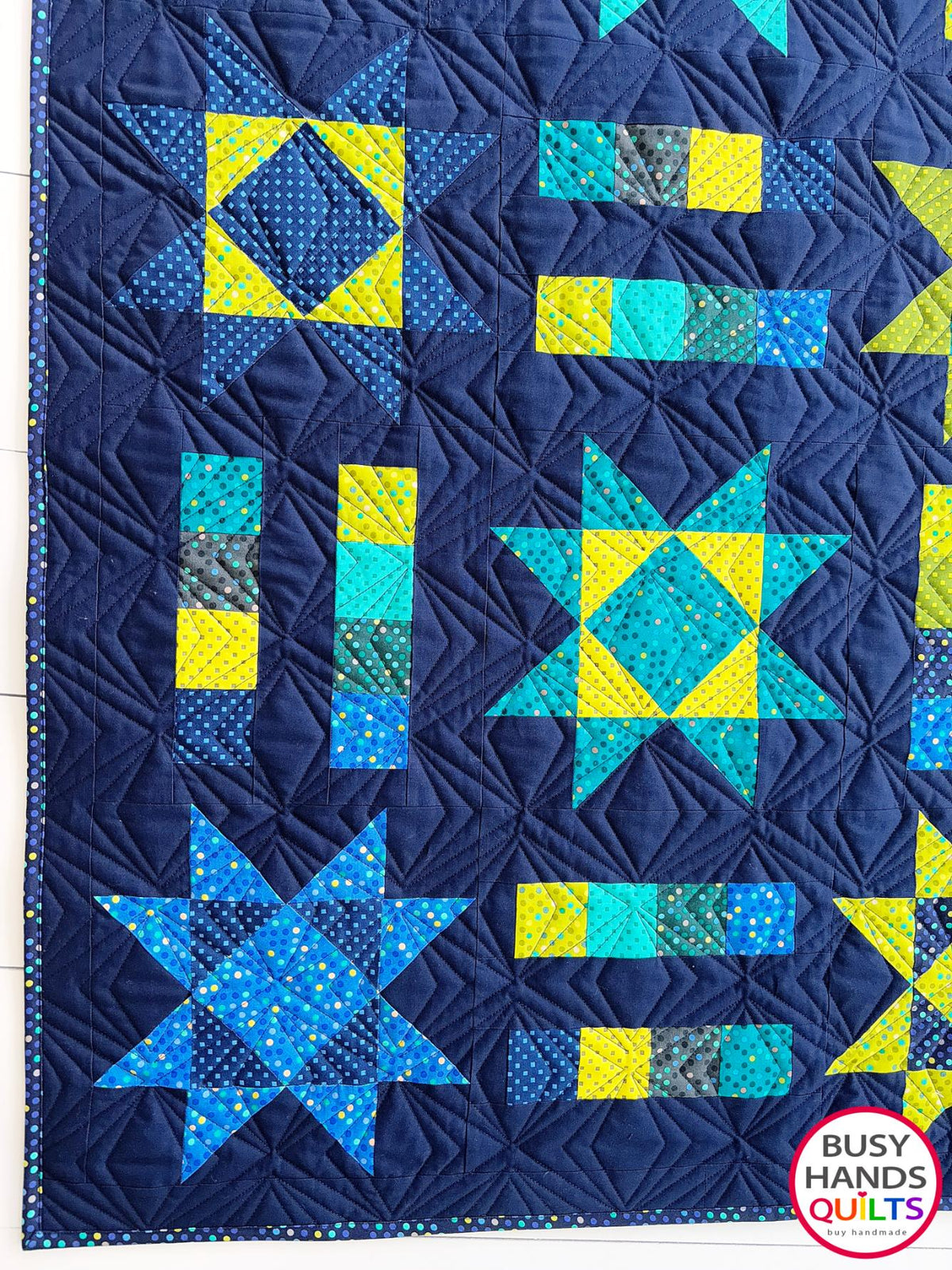 Handmade, heirloom-quality Throw Quilt with Stars and Stripes of Squares in blue, lime green, and aqua on a navy background. Perfect Christmas present idea, birthday gift idea with bright colors.