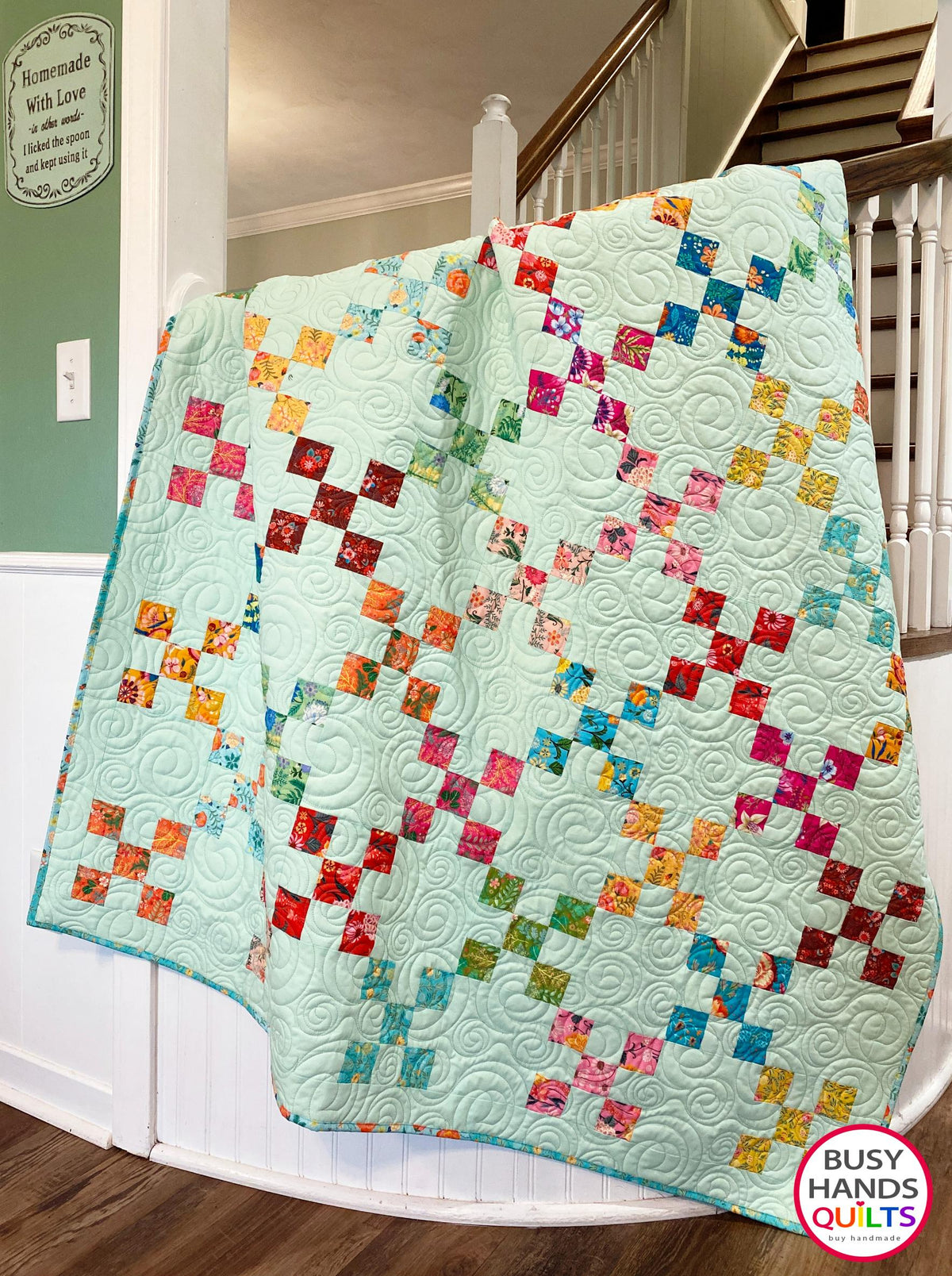 Handmade, heirloom-quality traditional 9-patch quilt in pretty floral prints on a solid mint colored background. Perfect as a Christmas present idea or birthday gift idea for women and young girls.