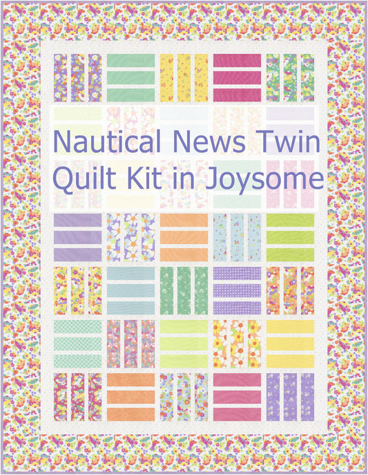Nautical News twin size patchwork bed quilt in purple, yellow, mint green, orange, pink on a bed in a young girl's bedroom in Joysome fabrics, pattern by Busy Hands Quilts